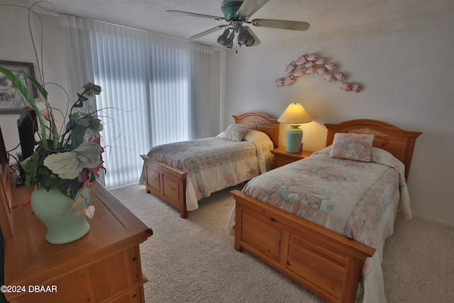 bedroom with light colored carpet and ceiling fan