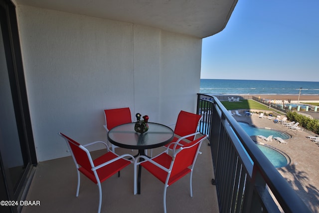 balcony featuring a water view