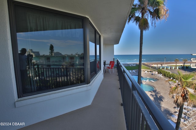 balcony featuring a water view