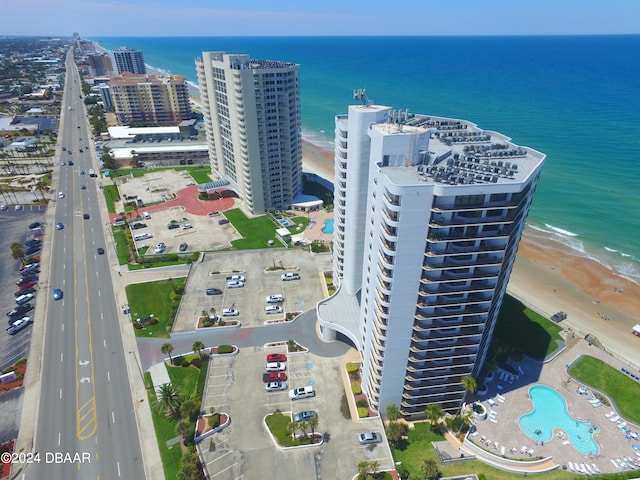 aerial view with a view of the beach and a water view