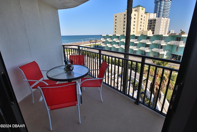 balcony featuring a water view