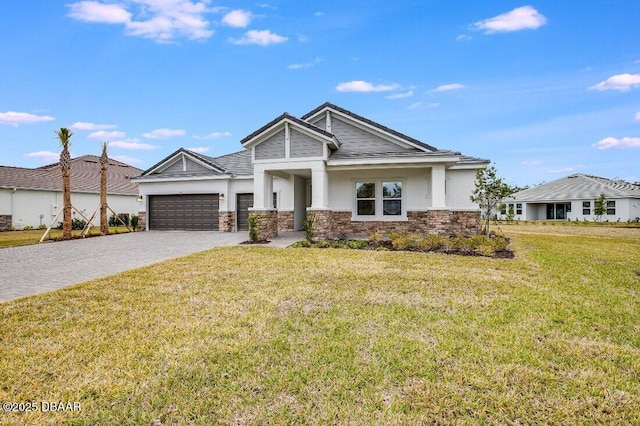 view of front of property with a garage and a front lawn