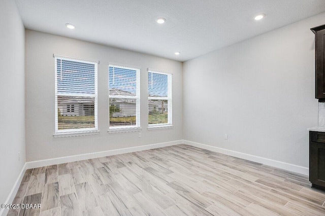 unfurnished living room featuring light hardwood / wood-style floors