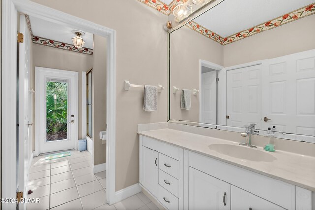 bathroom featuring tile patterned flooring and vanity