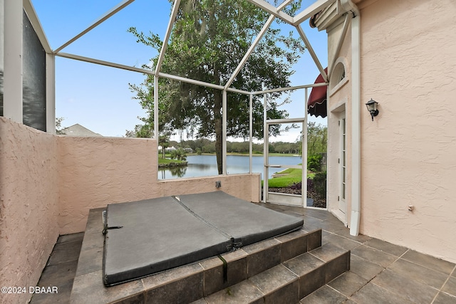 view of patio with a water view