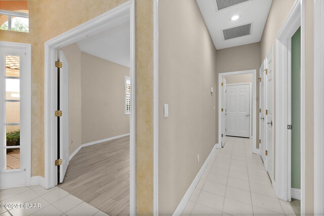 hallway with light hardwood / wood-style flooring