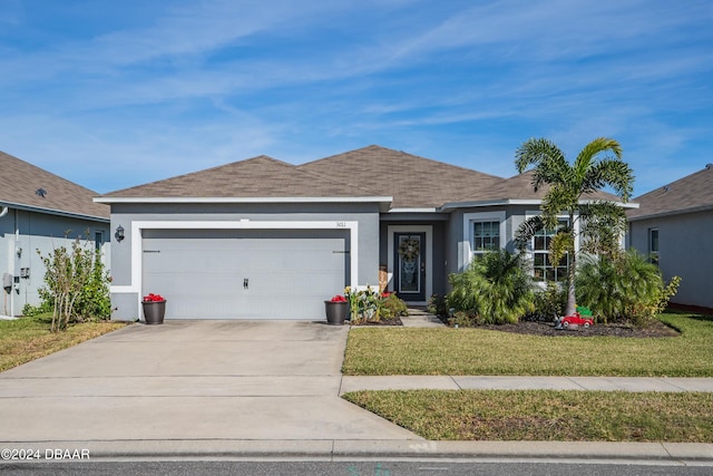 ranch-style house with a garage and a front yard