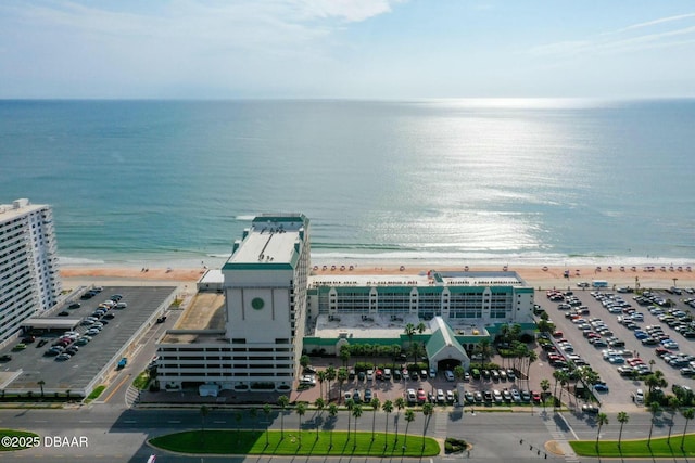 drone / aerial view with a water view and a view of the beach