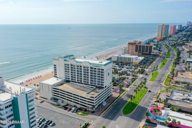 bird's eye view featuring a water view and a view of the beach