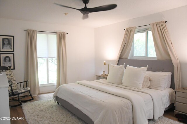 bedroom featuring wood finished floors and a ceiling fan