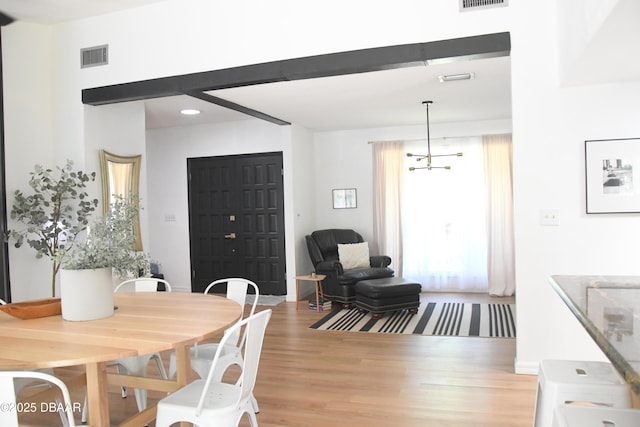 dining space with light wood-type flooring