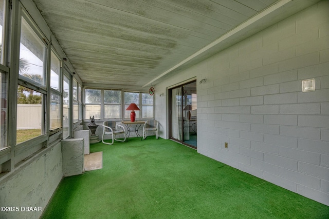 unfurnished sunroom featuring wooden ceiling