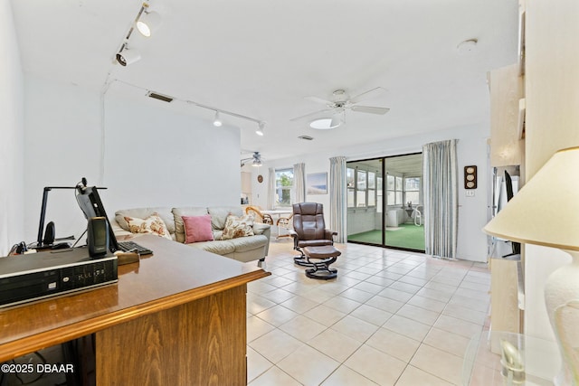 tiled living room featuring ceiling fan