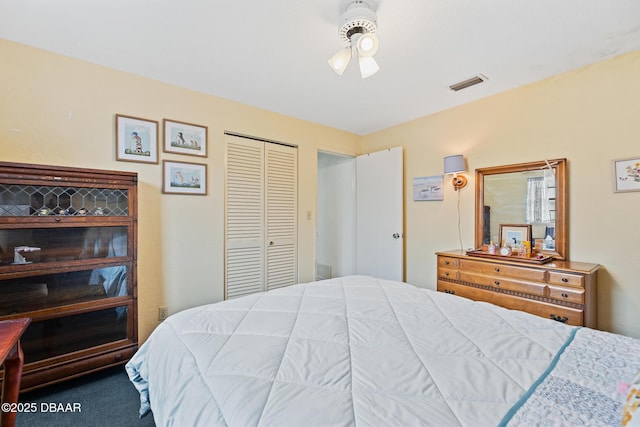 bedroom featuring ceiling fan, a closet, and carpet flooring