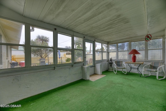 unfurnished sunroom with wood ceiling