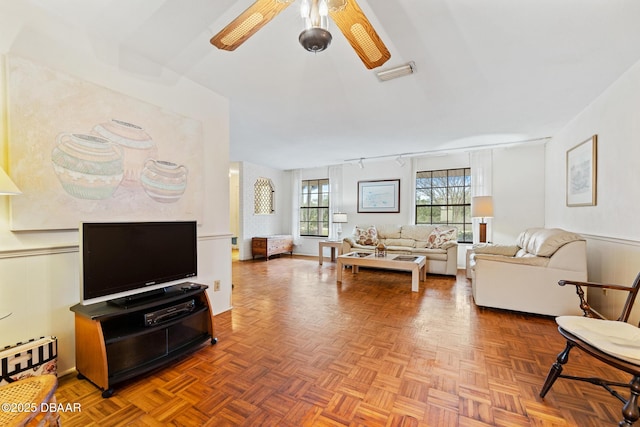 living room featuring parquet floors