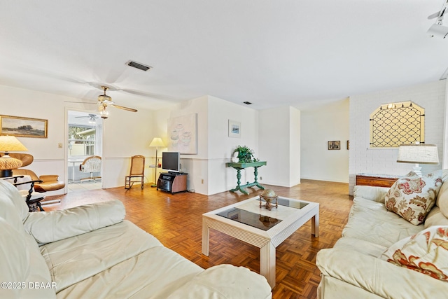 living room featuring parquet flooring