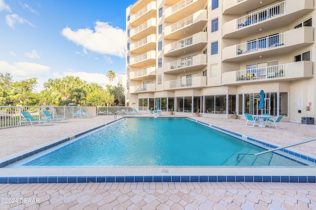 view of pool featuring a patio area