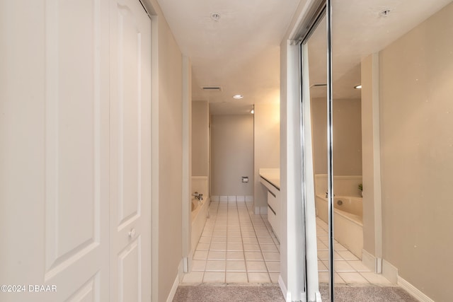 hallway with light tile patterned floors