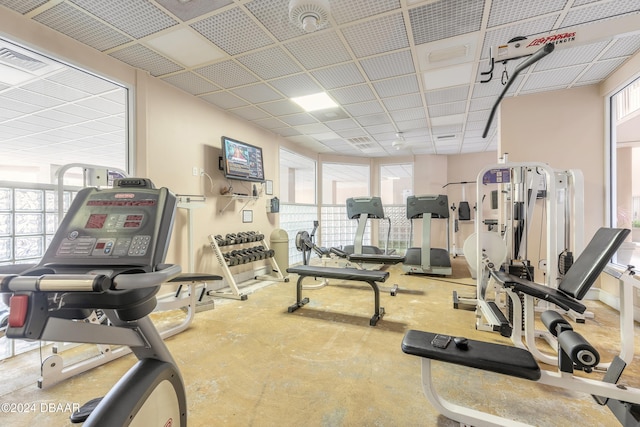 workout area with a paneled ceiling