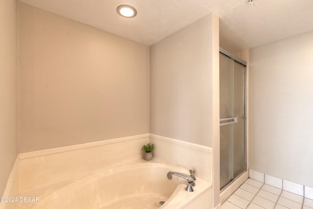 bathroom with tile patterned flooring and plus walk in shower