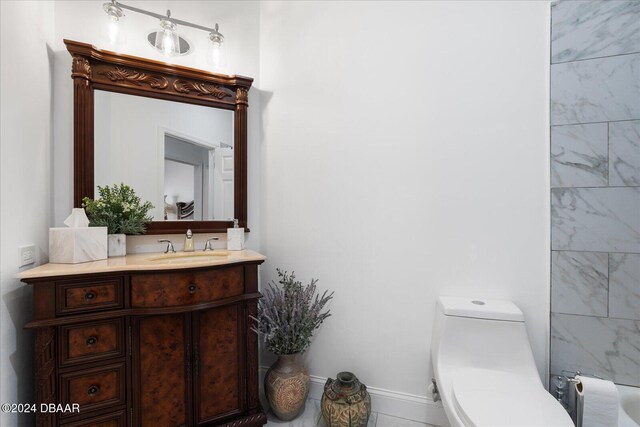 bathroom with tile patterned floors, vanity, and toilet