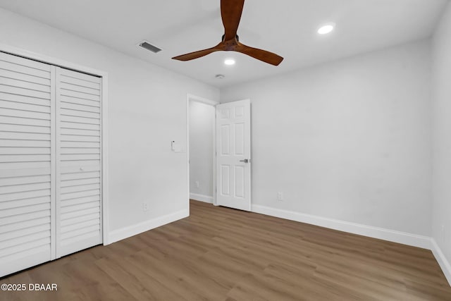 969 Commerce Rd SE Se, Unit Se, Palm Bay, FL 32909 - unfurnished bedroom with wood finished floors, recessed lighting, a closet, and a ceiling fan