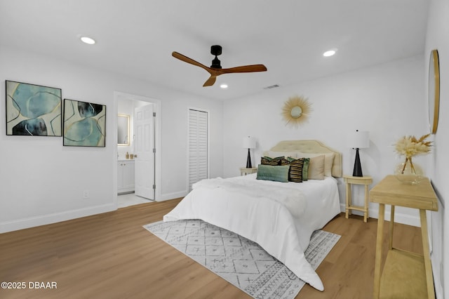 969 Commerce Rd SE Se, Unit Se, Palm Bay, FL 32909 - bedroom featuring wood finished floors, recessed lighting, ensuite bathroom, and a ceiling fan