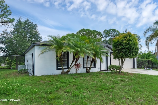 969 Commerce Rd SE Se, Unit Se, Palm Bay, FL 32909 - view of front of house featuring stucco siding, concrete driveway, and a garage