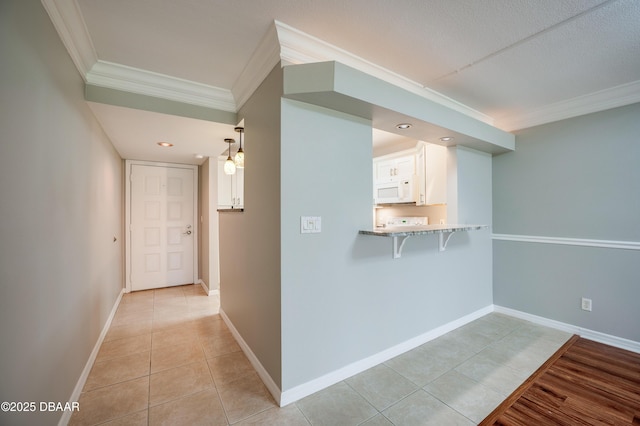 944 S Peninsula Dr Unit 104, Daytona Beach, FL 32118 - hall with crown molding, light tile patterned floors, and baseboards