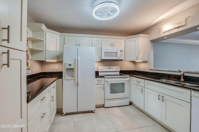 944 S Peninsula Dr Unit 104, Daytona Beach, FL 32118 - kitchen with white appliances, a sink, open shelves, white cabinets, and light tile patterned floors