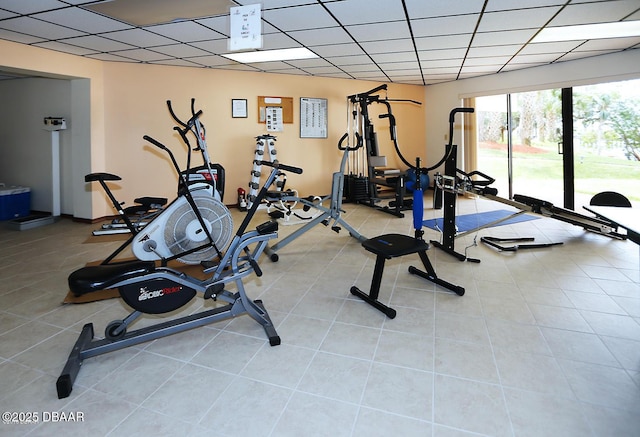 944 S Peninsula Dr Unit 104, Daytona Beach, FL 32118 - exercise area with a paneled ceiling and tile patterned floors