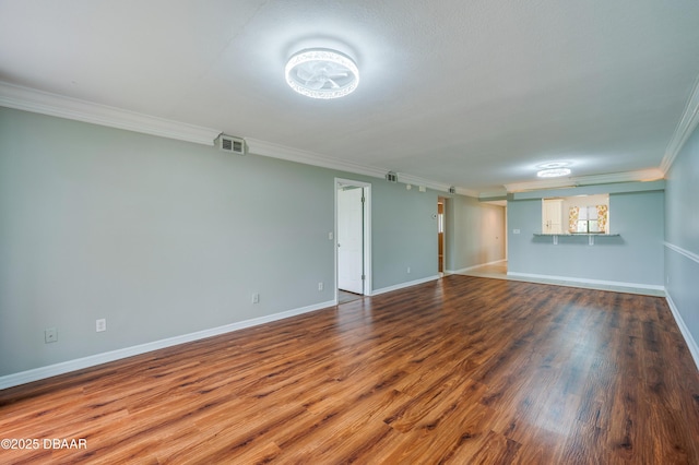 944 S Peninsula Dr Unit 104, Daytona Beach, FL 32118 - empty room featuring crown molding, wood finished floors, and baseboards