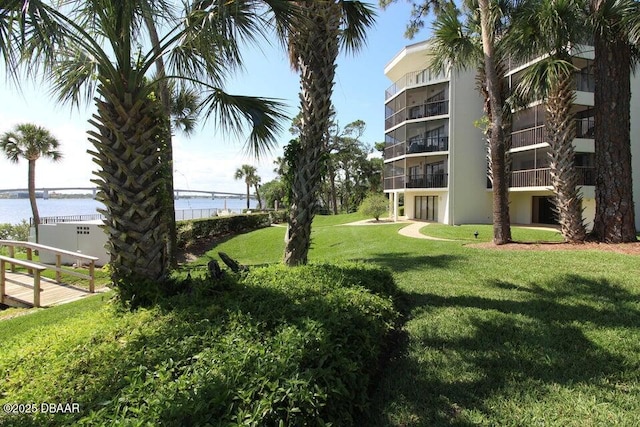 944 S Peninsula Dr Unit 104, Daytona Beach, FL 32118 - view of home's community with a yard and a water view