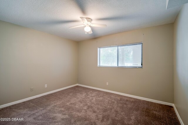 944 S Peninsula Dr Unit 104, Daytona Beach, FL 32118 - carpeted empty room featuring a ceiling fan, baseboards, and a textured ceiling