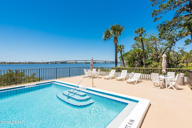 944 S Peninsula Dr Unit 104, Daytona Beach, FL 32118 - community pool featuring a water view, a patio area, and fence