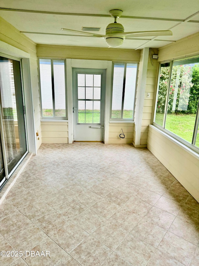 528 Crooked Stick Dr, Daytona Beach, FL 32114 - unfurnished sunroom featuring tile patterned floors and wooden walls