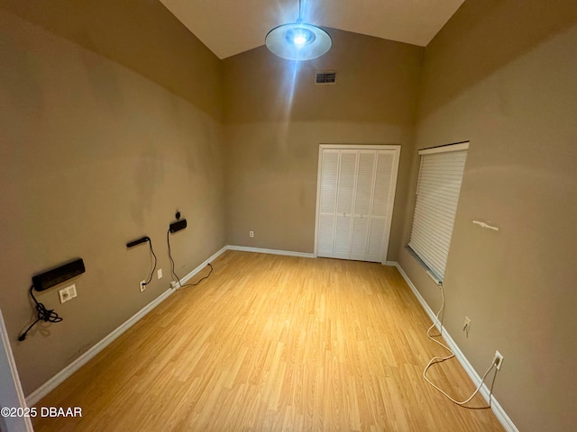 528 Crooked Stick Dr, Daytona Beach, FL 32114 - unfurnished bedroom featuring light wood finished floors, a towering ceiling, and a closet