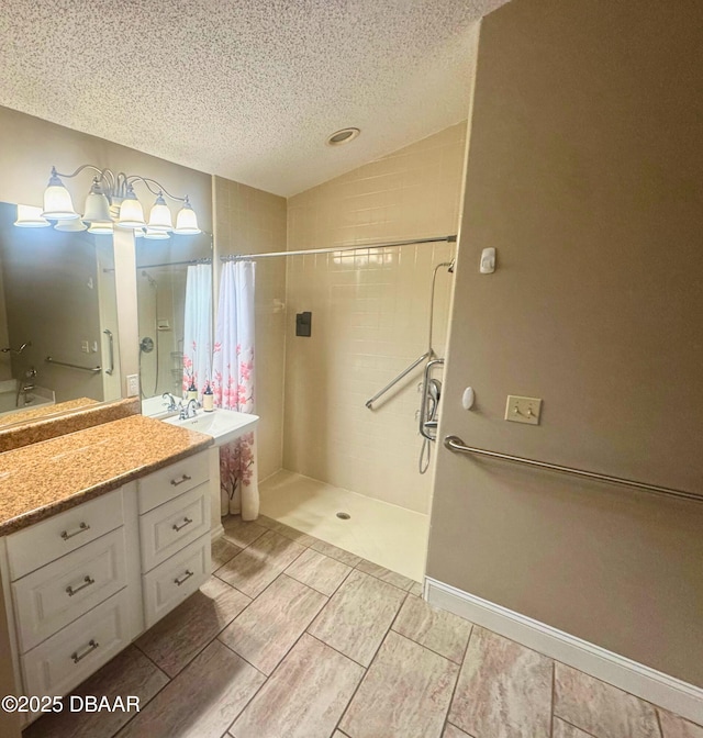 528 Crooked Stick Dr, Daytona Beach, FL 32114 - bathroom with a textured ceiling, a tile shower, lofted ceiling, and vanity