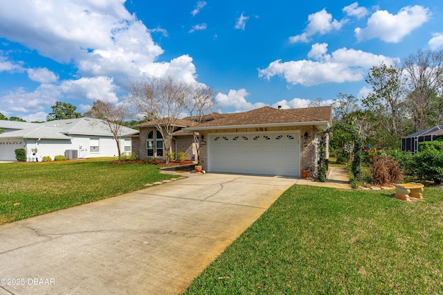 ranch-style home featuring a garage, central AC unit, and a front yard