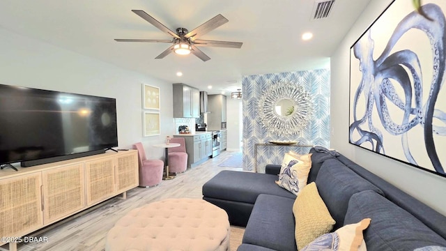 70 Ocean Shore Dr, Ormond Beach, FL 32176 - living area featuring light wood finished floors, ceiling fan, and recessed lighting