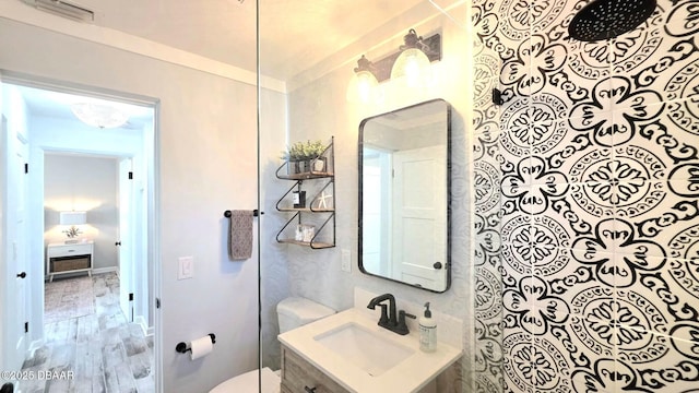 70 Ocean Shore Dr, Ormond Beach, FL 32176 - bathroom featuring toilet, vanity, and a shower