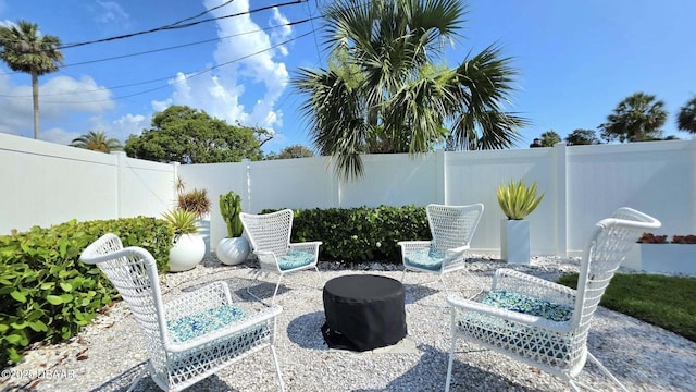 70 Ocean Shore Dr, Ormond Beach, FL 32176 - fenced backyard with a patio area