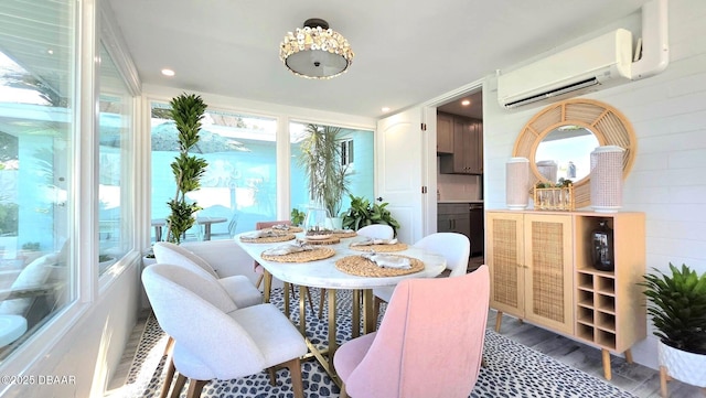 70 Ocean Shore Dr, Ormond Beach, FL 32176 - dining space featuring an AC wall unit, plenty of natural light, wood finished floors, and recessed lighting