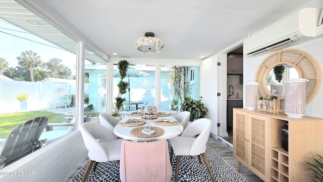 70 Ocean Shore Dr, Ormond Beach, FL 32176 - dining space featuring a wall unit AC and wood finished floors