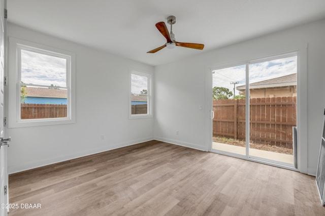 2419 India Palm Dr, Edgewater, FL 32141 - empty room featuring baseboards, a wealth of natural light, light wood finished floors, and ceiling fan