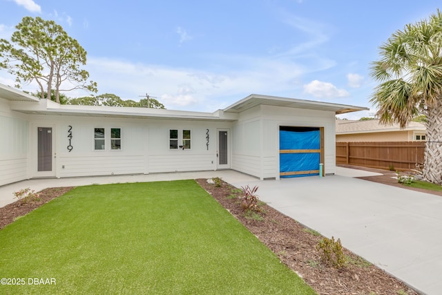 2419 India Palm Dr, Edgewater, FL 32141 - view of front of property featuring fence and a front yard