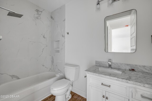 2419 India Palm Dr, Edgewater, FL 32141 - bathroom with vanity, toilet,  shower combination, and wood finished floors