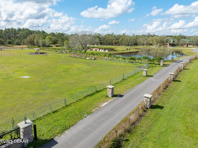 drone / aerial view featuring a rural view and a water view