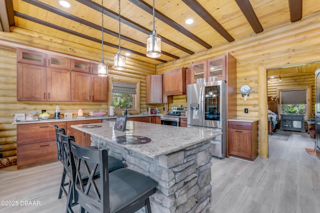 kitchen with wood ceiling, a kitchen island, beamed ceiling, stainless steel appliances, and light wood-type flooring